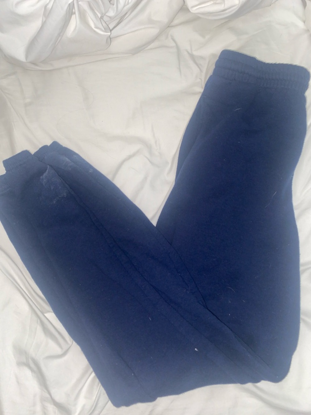 Navy blue sweatpants with drawstrings